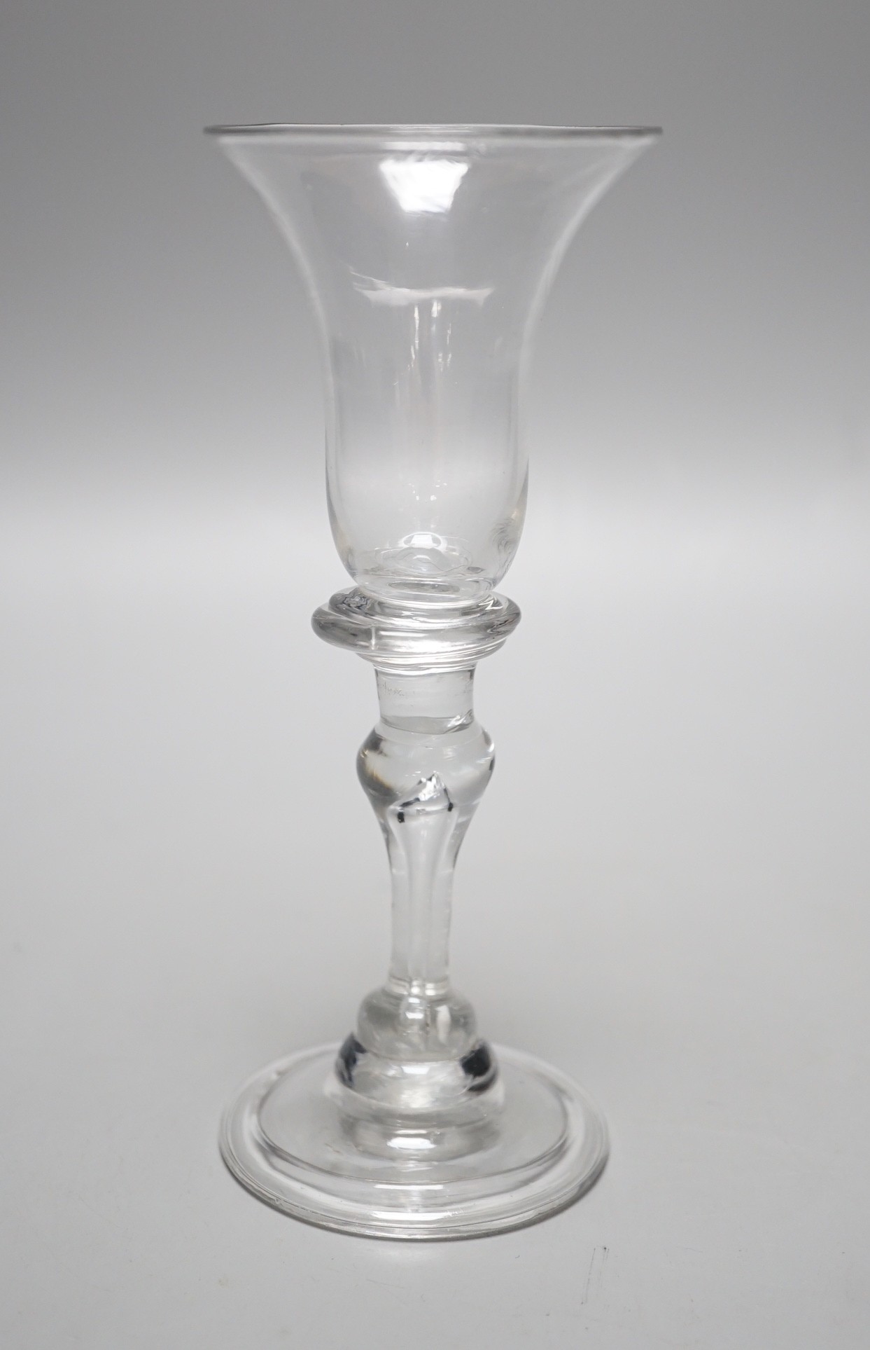 A George II wine glass with inverted teardrop baluster stem, 15.5cm tall